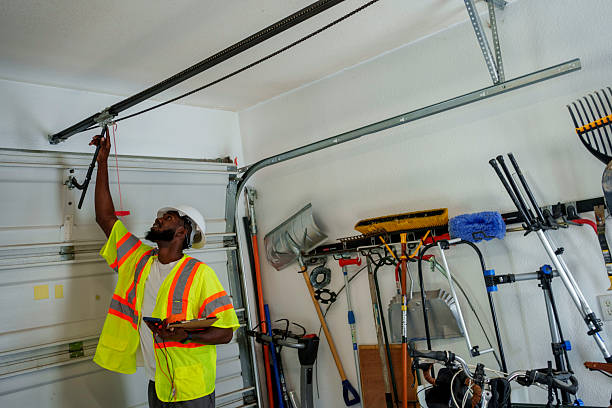 Professional Garage Door Roller Replacement technician working in Wood Village, OR